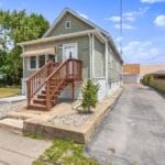 Exterior entrance and stairway of an Affordable Living Company shared housing home