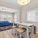 Living room with sofa and coffee table in an Affordable Living Company shared housing home