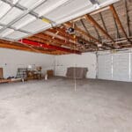 Garage interior with storage space at an Affordable Living Company property