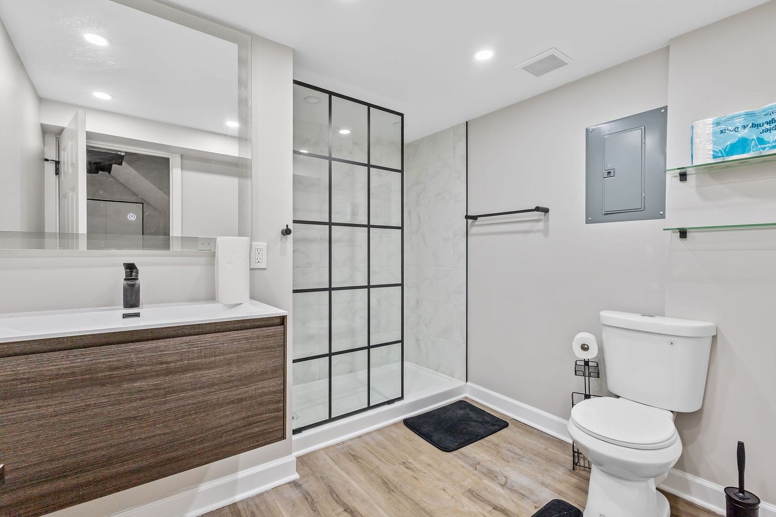 Lower level bathroom with walk in glass shower and vanity in Hammond, Indiana