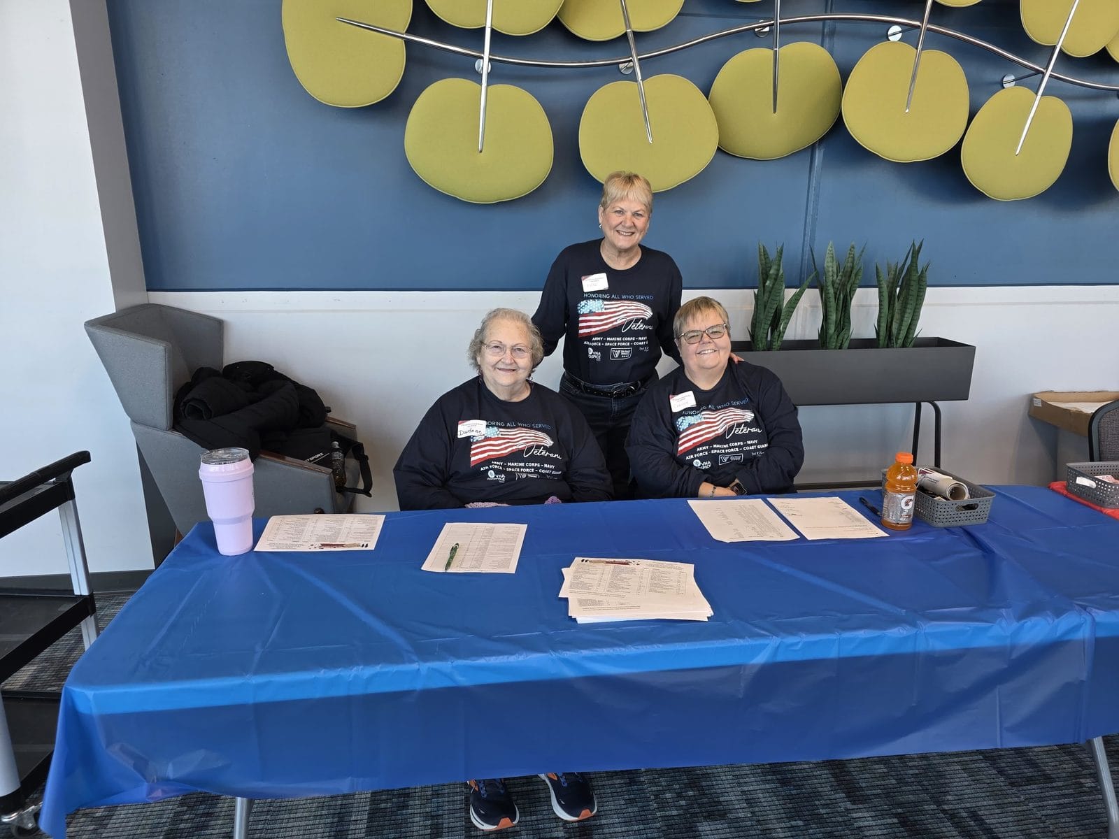 Volunteers staffing the veteran check-in table at the Lake County Military Stand Down in Northwest Indiana