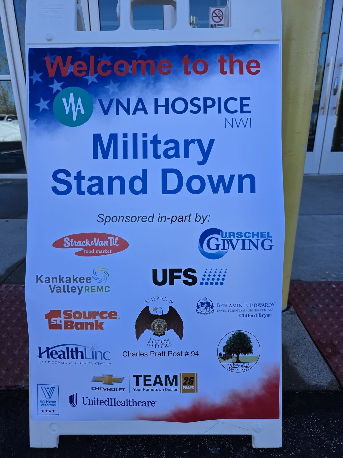Welcome sign for the VNA Hospice NWI Military Stand Down listing the event sponsors